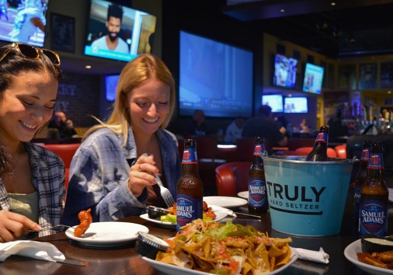 two women at a sports bar table