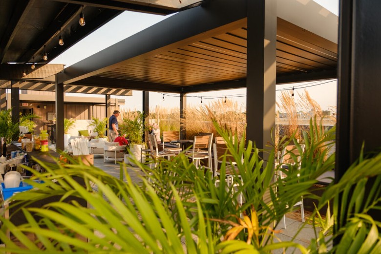 a rooftop patio with restaurant seating