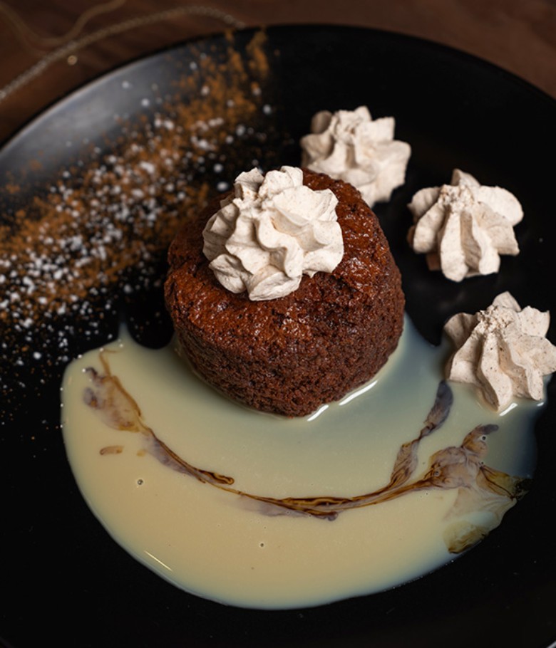 a chocolate cake dessert with whipped topping