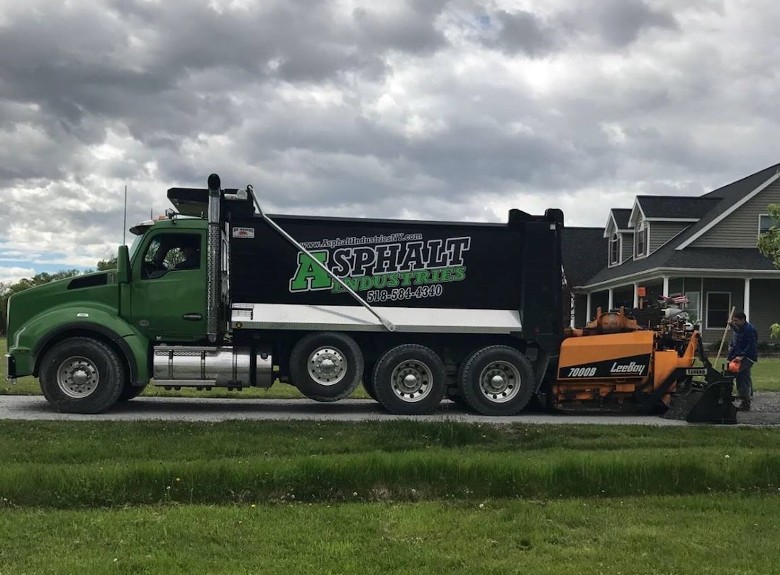 a truck with asphalt industries on the side