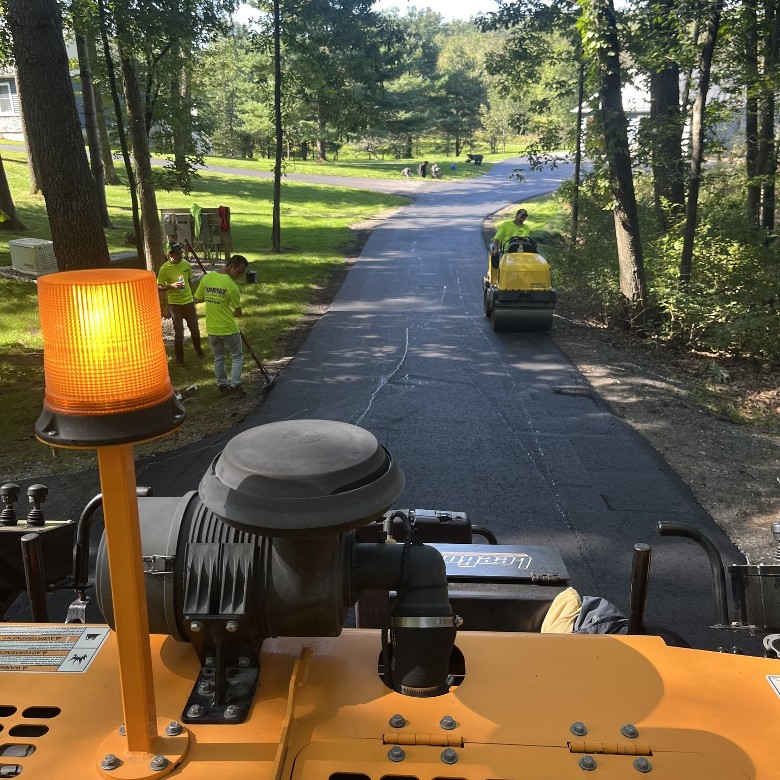 an asphalt paver on driveway