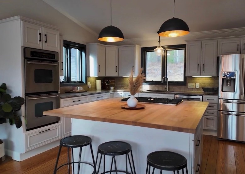 an open space kitchen with a central island