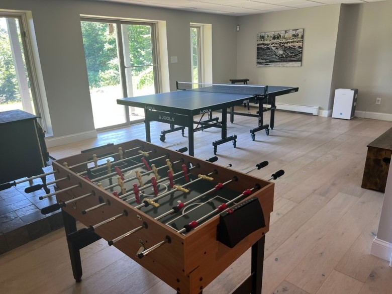 a foosball table, ping pong, and more in a lounge