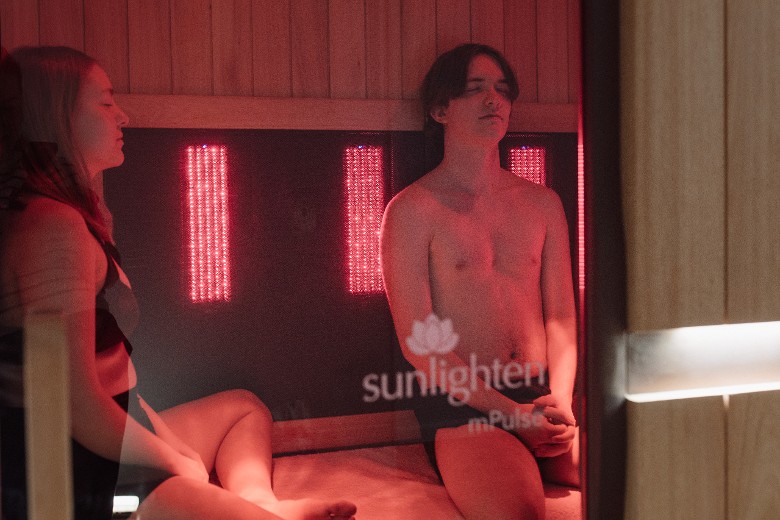 man and woman in sauna