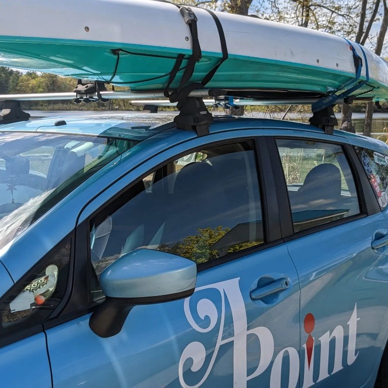 APoint Shuttle car with kayak on top