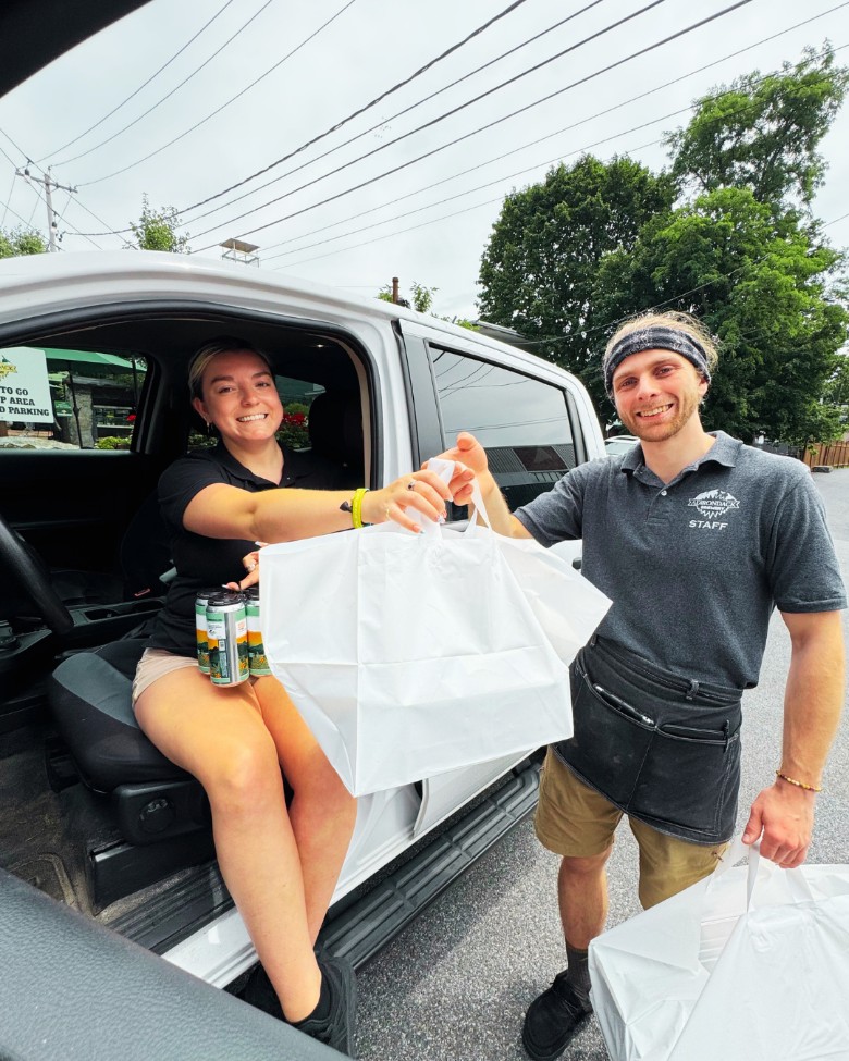 a man and woman with catering pickup