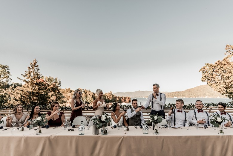wedding party at the main table outdoors