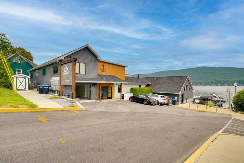 view of a condo rental by road leading to the lake