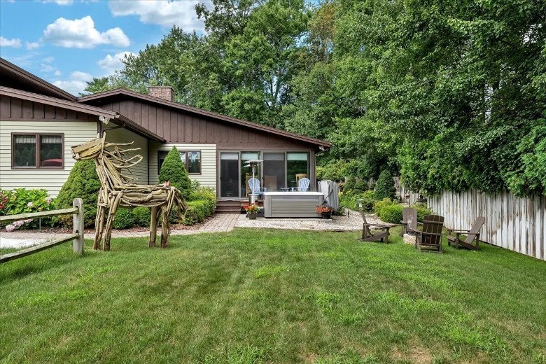 house with hot tub outside porch door
