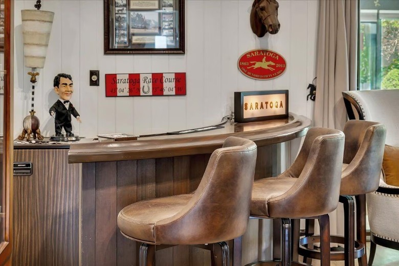 small bar seating area in a house with Saratoga horse themed decor
