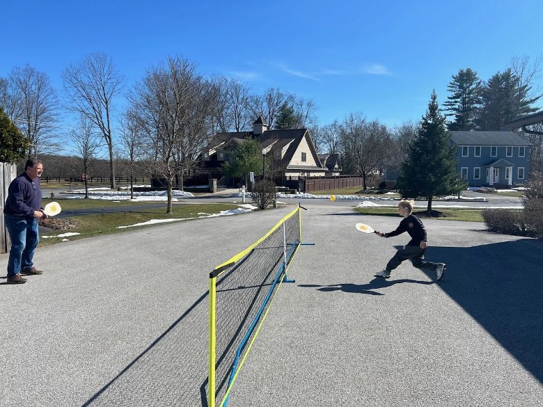 two people playing pickleball