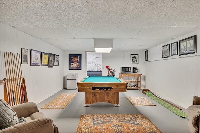 a game room with a pool table