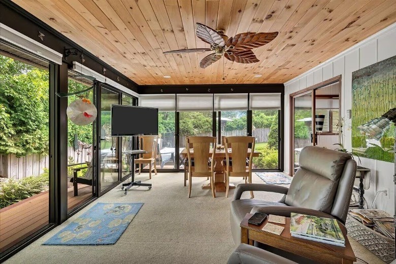 an enclosed sun room with furniture
