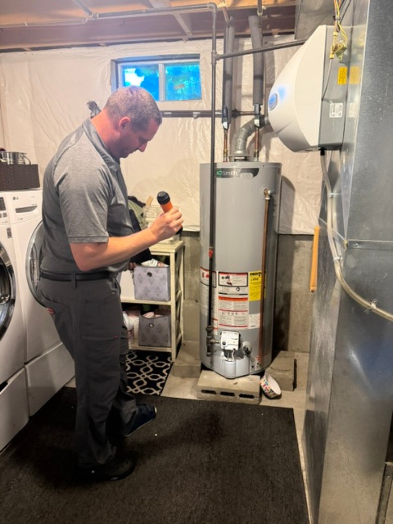 They're your eyes when you're away, performing regular inspections, seasonal property care, vendor management, and more - with detailed reports for you afterwards. man inspecting furnace area