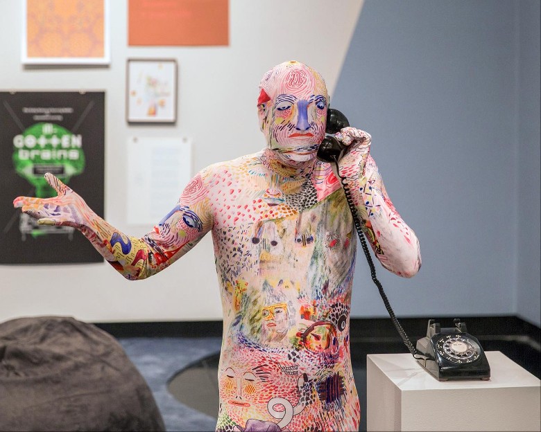 art sculpture of man on telephone