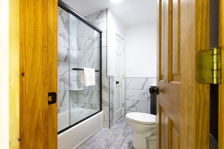 bathroom with toilet and shower