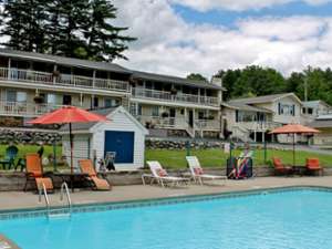 exterior of a hotel with pool in front