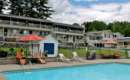 exterior of a hotel with pool in front