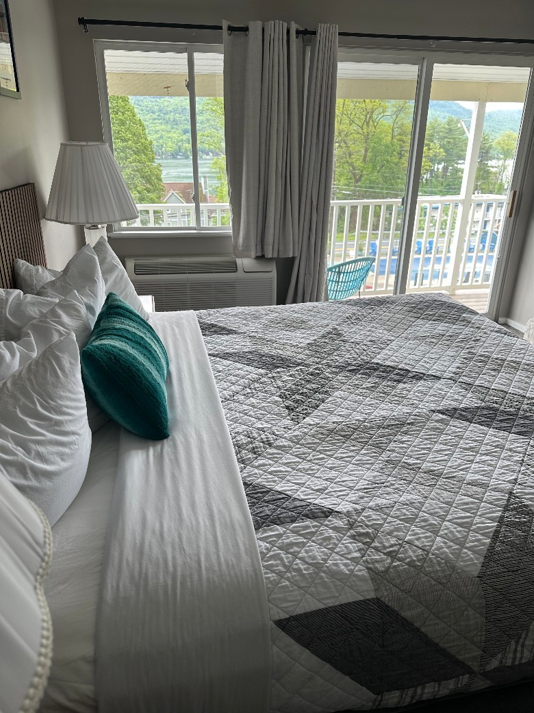 motel bed by deck doors
