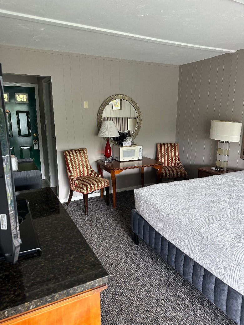 chairs and bed in bedroom