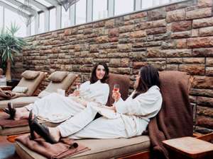 two women in robes at a spa