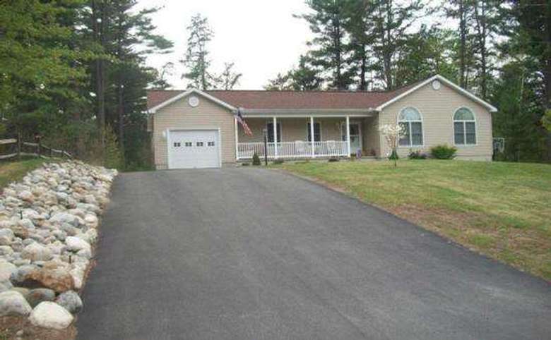 Long driveway with house in the background