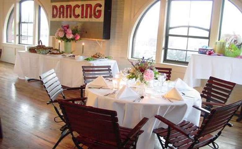 tables and chairs set up for a formal event like a bridal shower or a rehearsal dinner