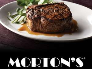 steak on a plate with brown sauce and the morton's logo