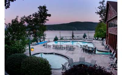 Lake George Resorts Luxury Lodging At More On Somewhat Aerial View Of Two Pools At Dusk