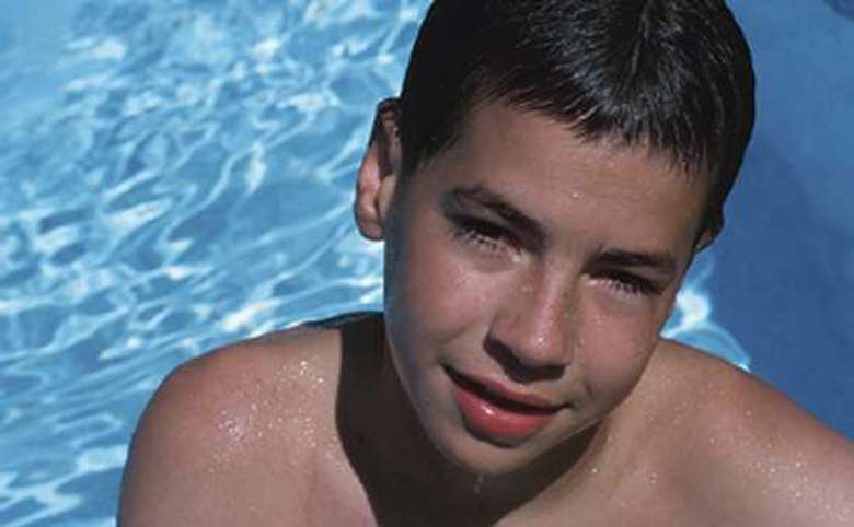 boy in an outdoor pool