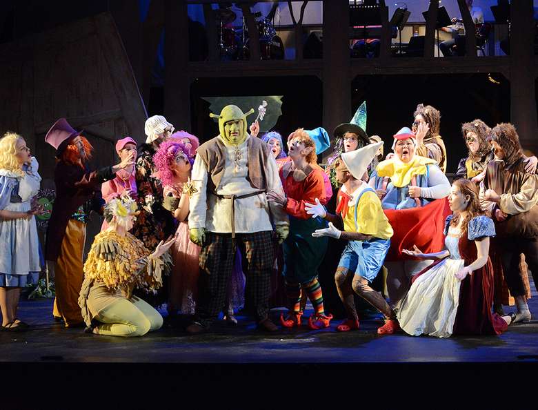 cast of shrek the musical performing on stage