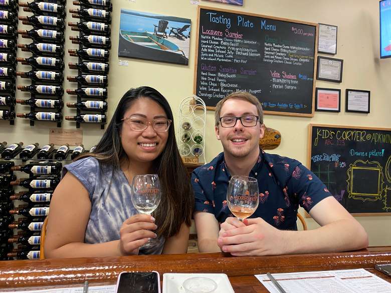 man and woman together in a winery tasting room