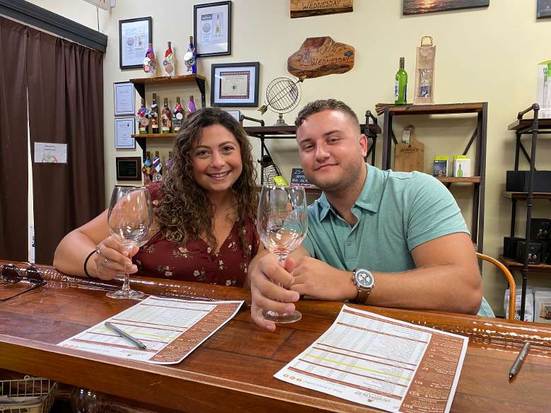 man and woman together in a winery tasting room