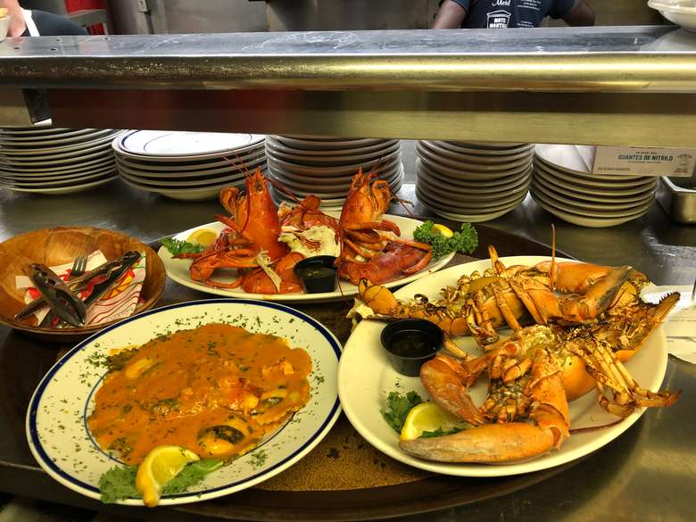 lobster and other seafood on plates
