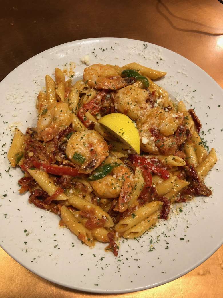 pasta and shrimp dinner on a plate