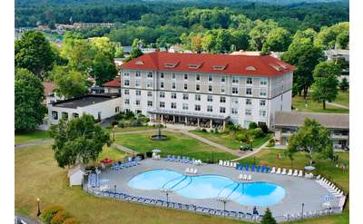 Grand hotel aerial view with pool