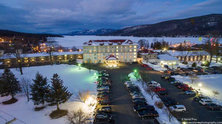 Winter aerial view of Fort William Henry Hotel at dusk
