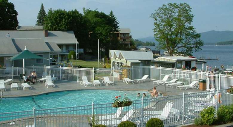 pool area at marine village resort with lake george in the background