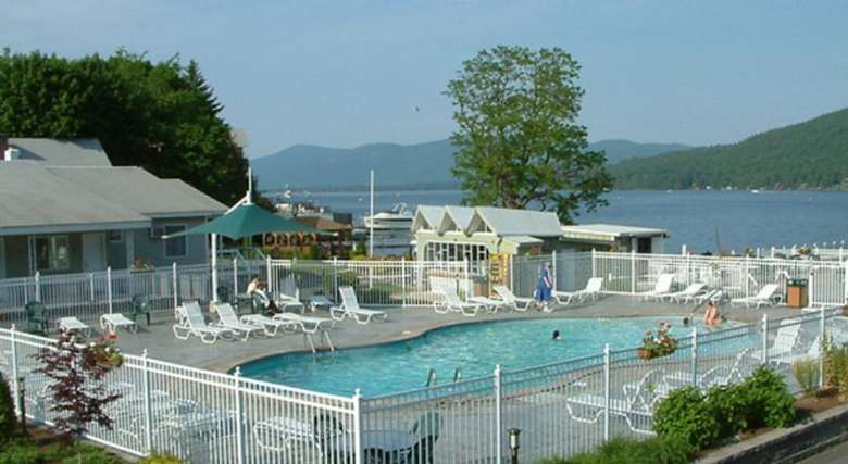 pool area at marine village resort with lake george in the background