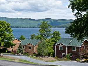 semi aerial view of cottages by lake