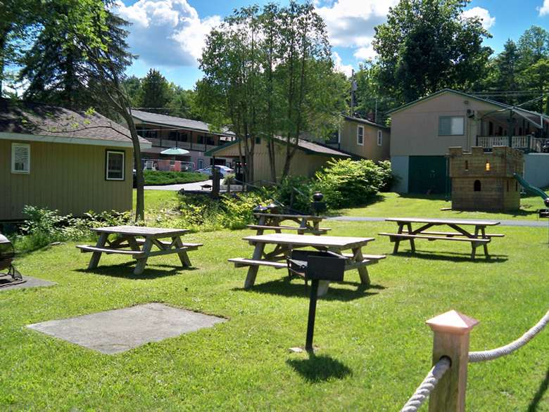 picnic tables on grass, cottages