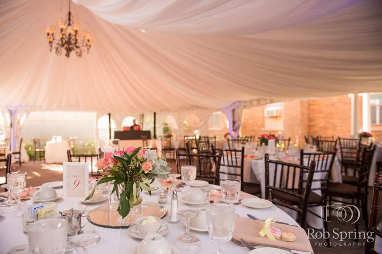 Tables outdoors under fabric tent