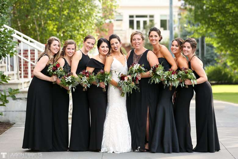 Bride and Bridesmaids standing together smiling