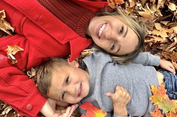 mom and kid in leaves