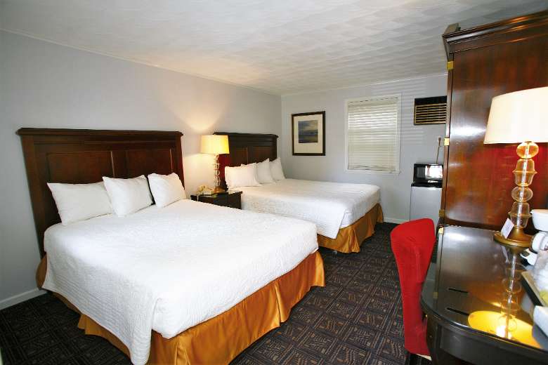 Deluxe room with two queen beds seen from desk