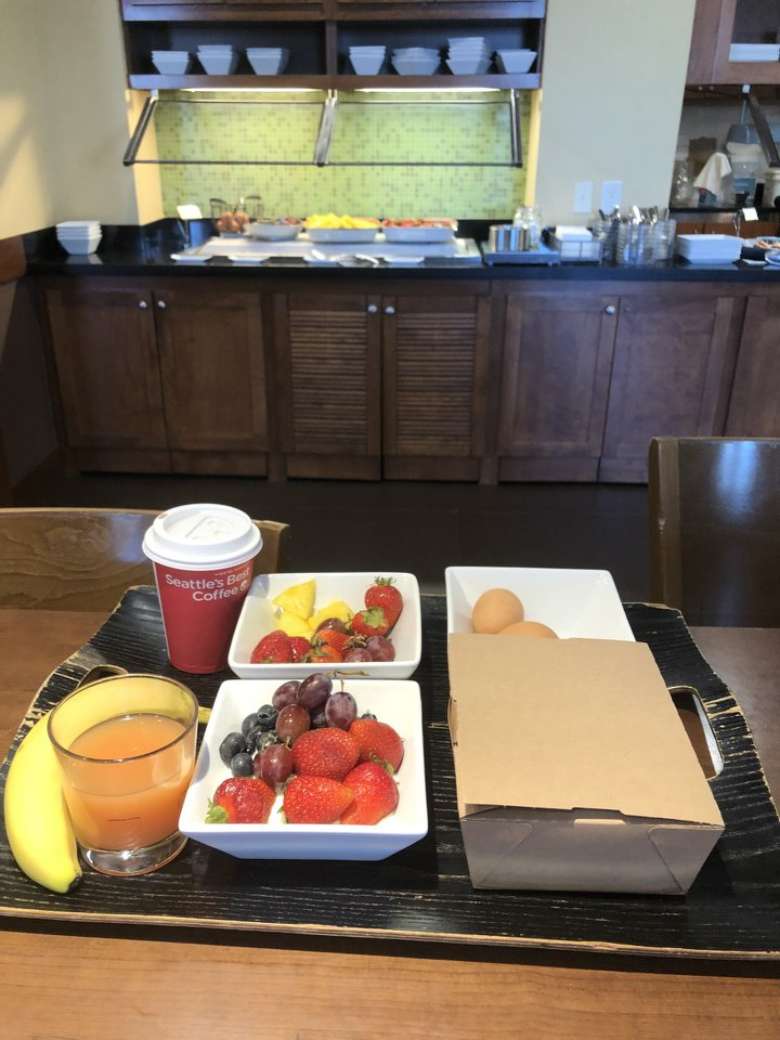 breakfast food and drinks on a tray