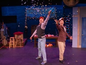 men with confetti on stage