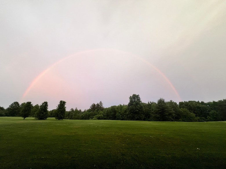 rainbow over a golf course