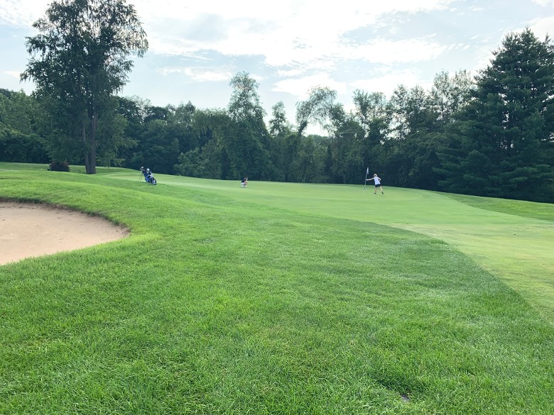 golf course with sandy area on the left