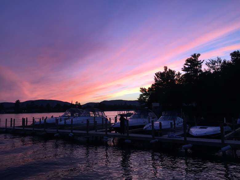 purple and pink sky during evening over a marina